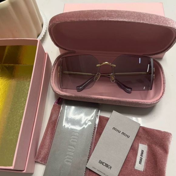 Miu Miu Sunglasses with Purple Lenses and Gold Accents - Picture 1 of 4